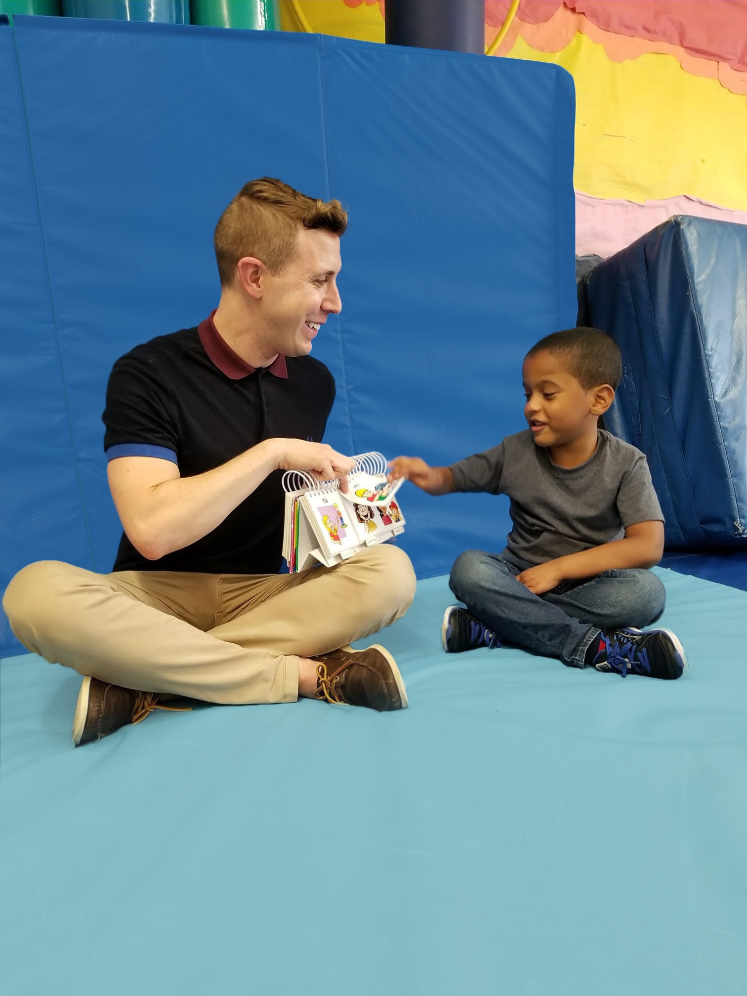 Daniel and student with a book