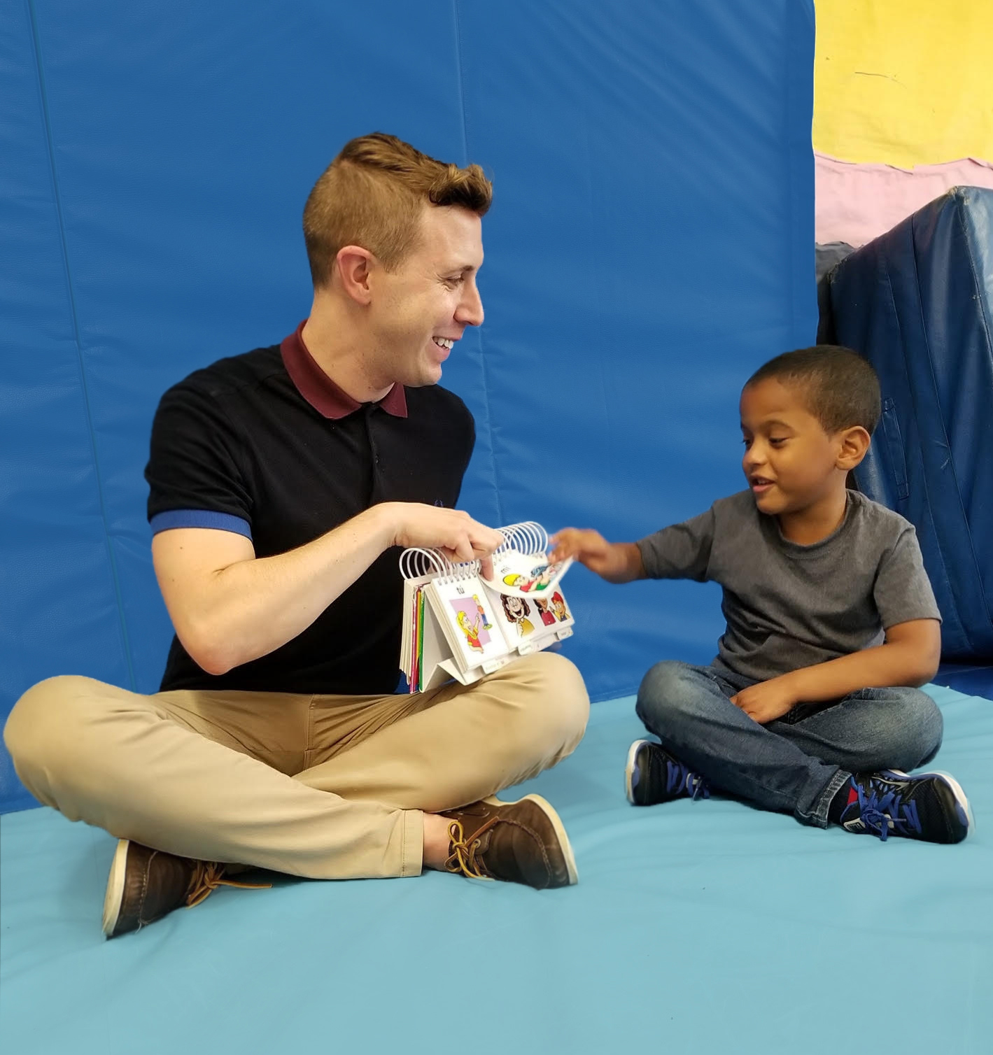 Daniel and student with a book